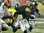 Ben Roethlisberger (7) dives for a second quarter touchdown as Cincinnati Bengals linebacker Landon Johnson lands on top of him during NFL football action in Pittsburgh, Sunday, Dec. 2, 2007.