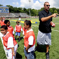 Ben directs his team  during his 2008 football camp.