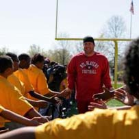 Ben instructs at a Special Olympics Football Camp.