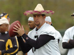 Senor Ben drops back to pass during drills on Sunday.