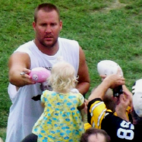Ben hands a little fan her little pink football back with his very big autograph on it!   Photo: Billie Jo Yakubik. *IF you do NOT have her permission to use/copy this photo or any of her photos, then DON'T.