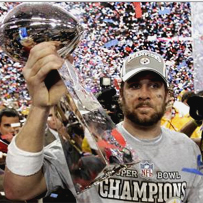Ben hoists the Super Bowl XL trophy high in the air. 